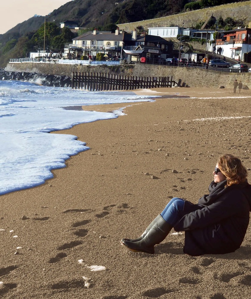 Caroline sitting on the beach